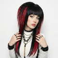 Front view of model is wearing the emo scene wig in black and red, styled with spiky, volume and texture. High-quality synthetic wig suitable for emo, scene, scenecore, y2k, and Harajuku fashion styles.