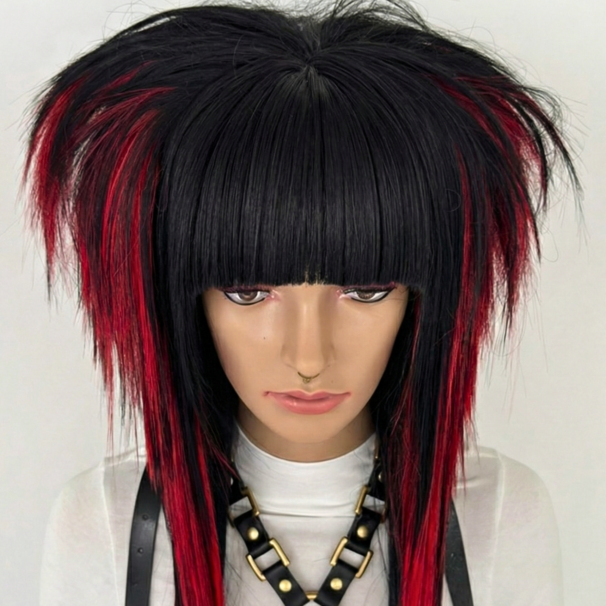 Close-up front view of the emo scene wig in black and red, styled with spiky, volume and texture. High-quality synthetic wig suitable for emo, scene, scenecore, y2k, and Harajuku fashion styles.