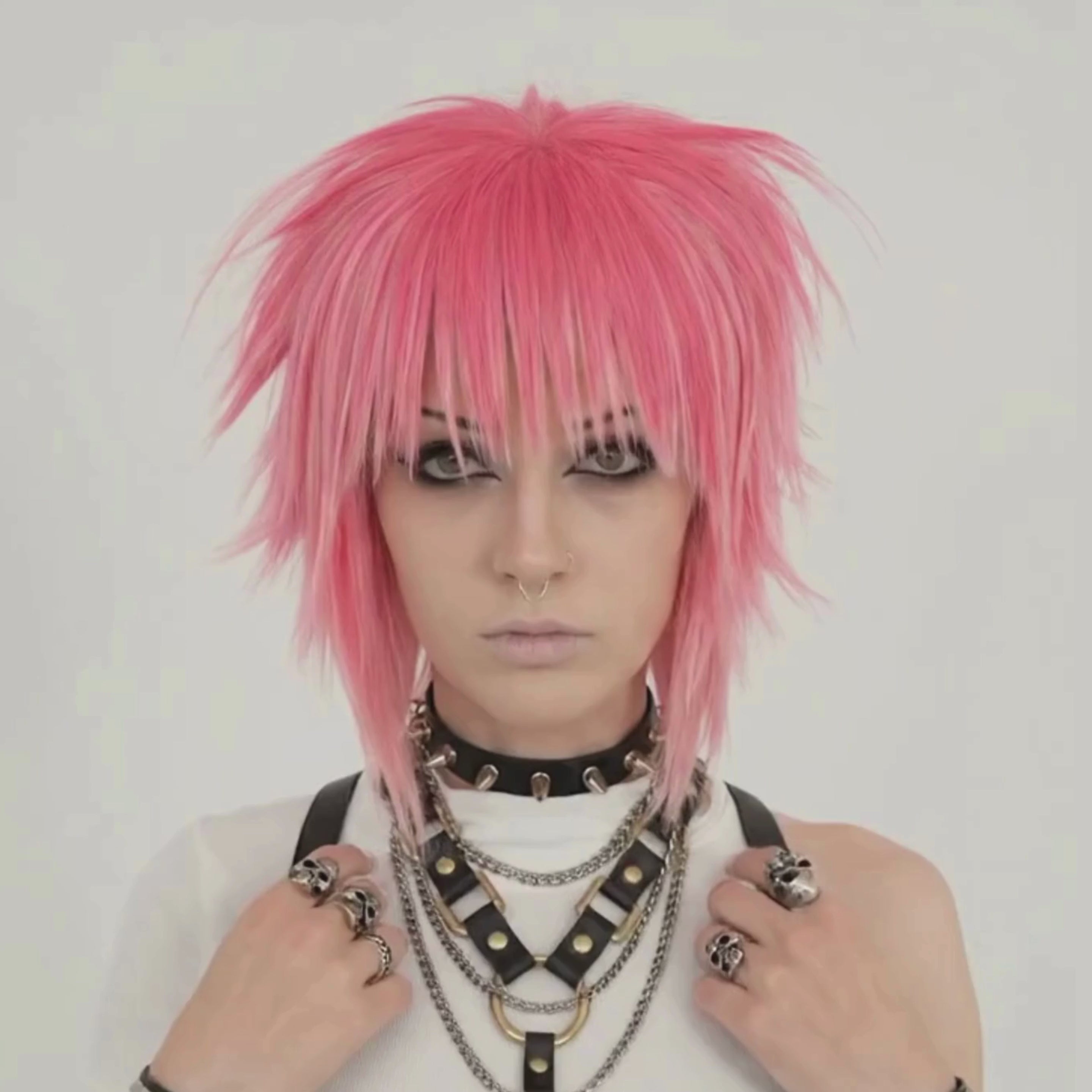 Short pink punk scene wig with layered cut profile view