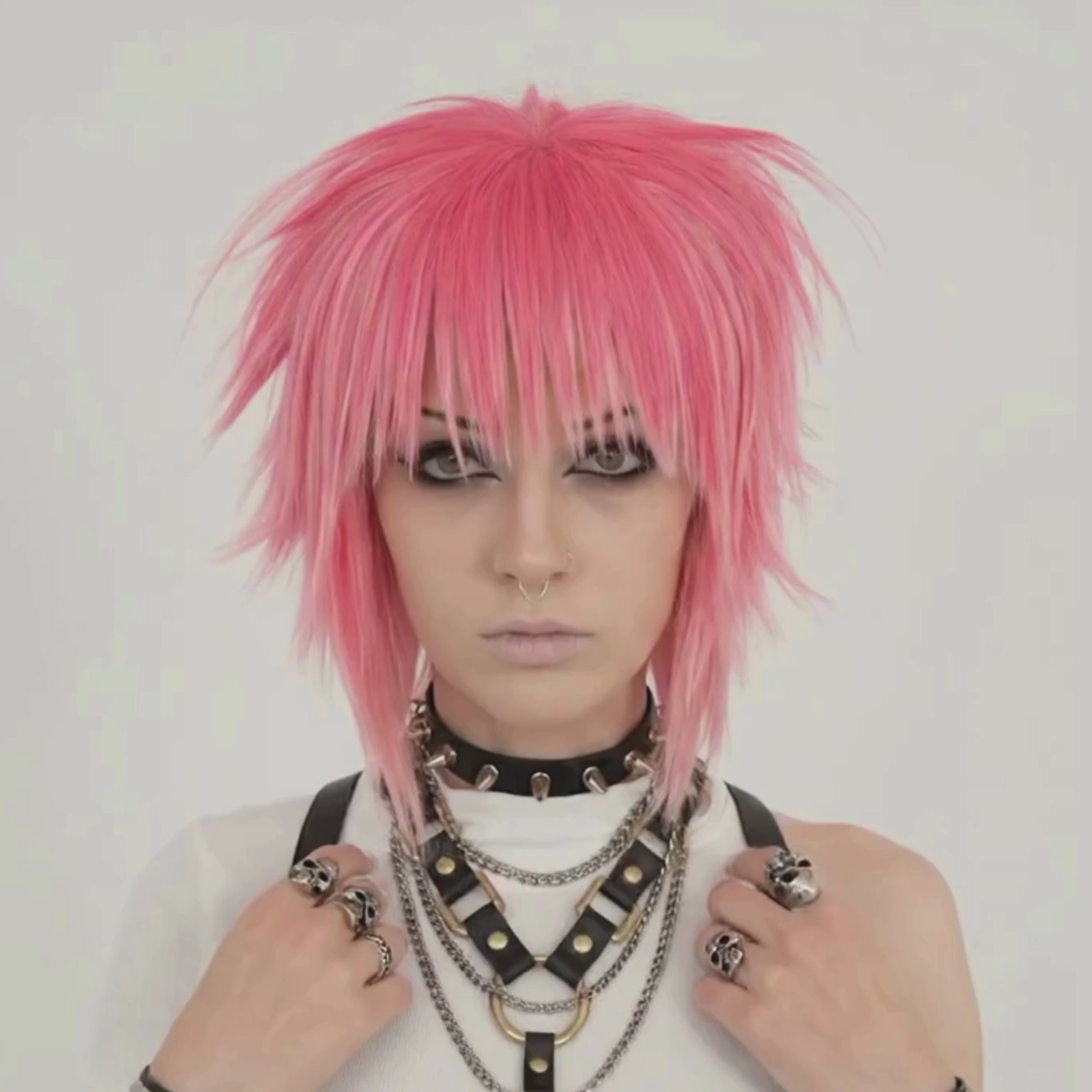 Short pink punk scene wig with layered cut profile view