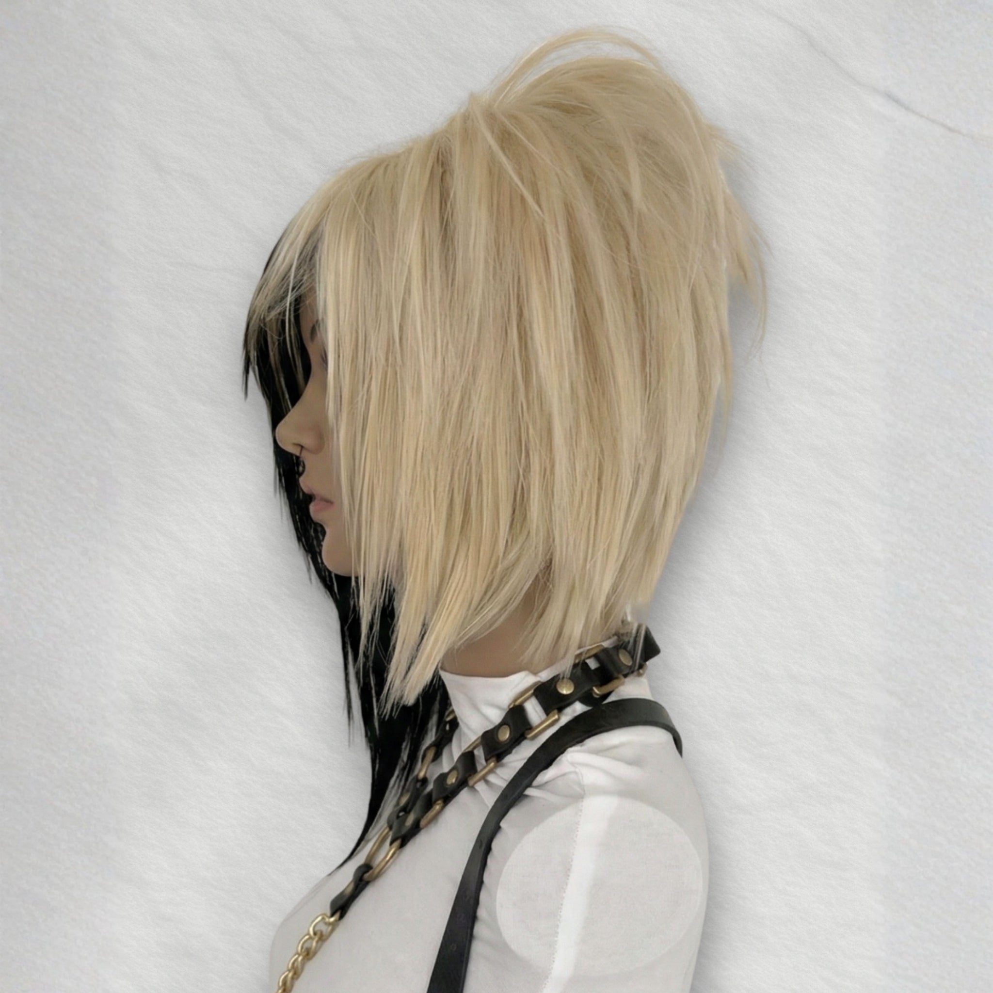 Right side view of short emo scene wig with side-swept bangs and layered asymmetrical bob, blonde and black synthetic wig with silk top for alternative fashion, visual kei and y2k cosplay hair.