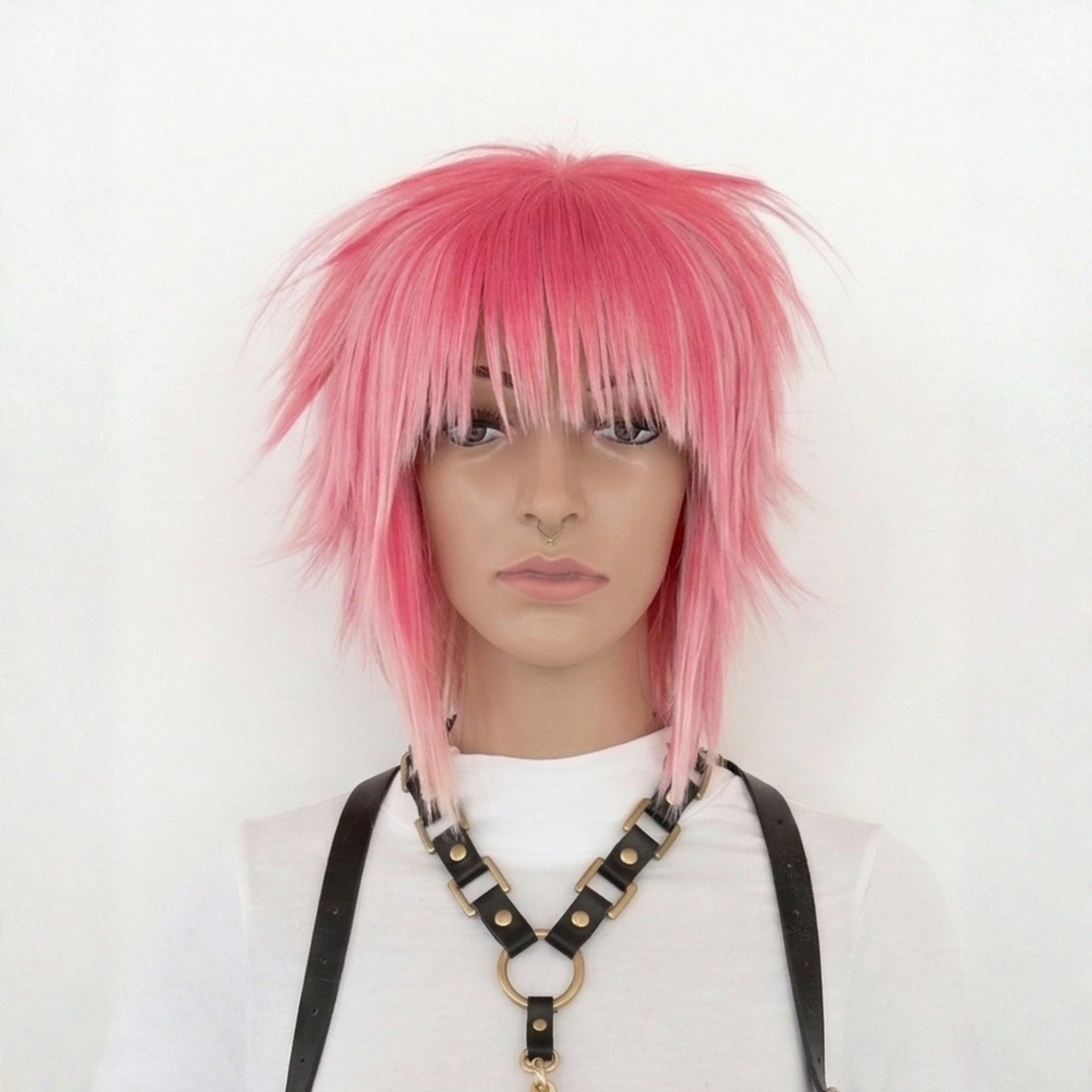 Short pink scene wig with spiky layered cut and straight choppy bangs front view