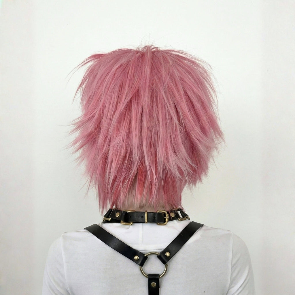 Back view of short pink scene wig with choppy layered haircut